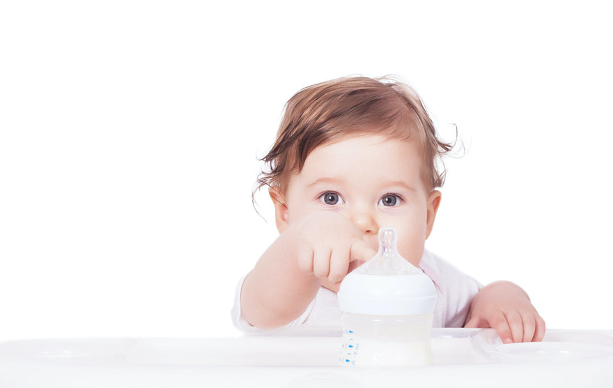 Baby pointing at bottle